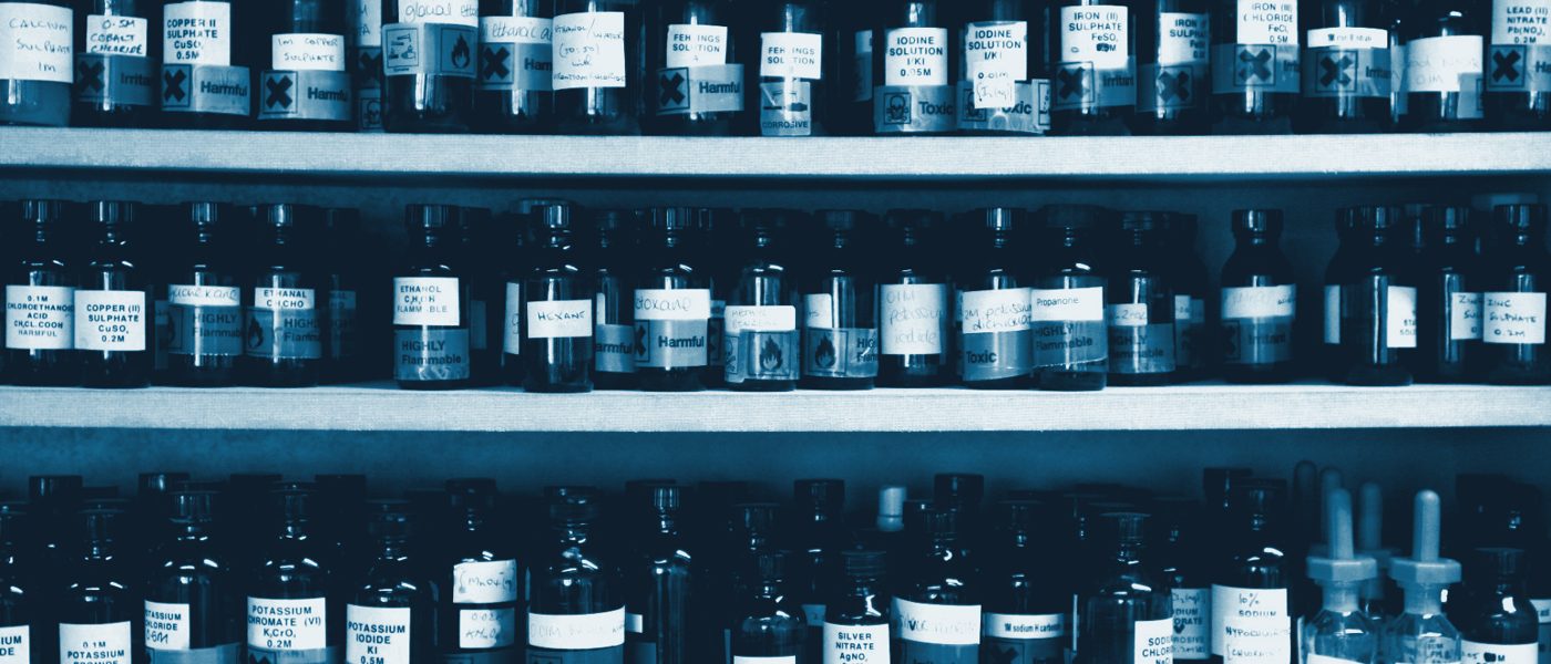 Shelves of labelled chemical bottles