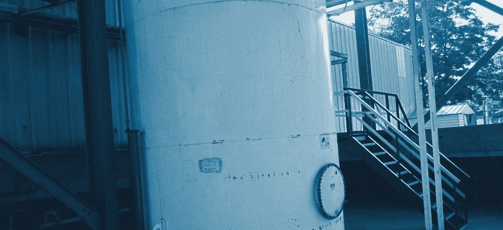 An above-ground diesel storage tank with access stairs